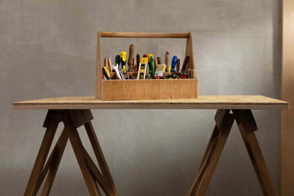 construction tools and toolbox at wooden table bac 2022 12 15 20 27 01 utc