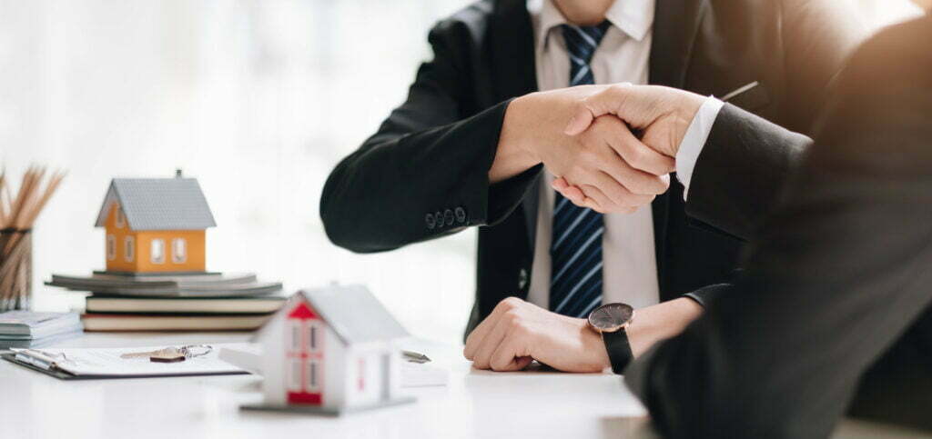 real estate broker and customer shaking hands afte 2022 10 03 22 01 11 utc