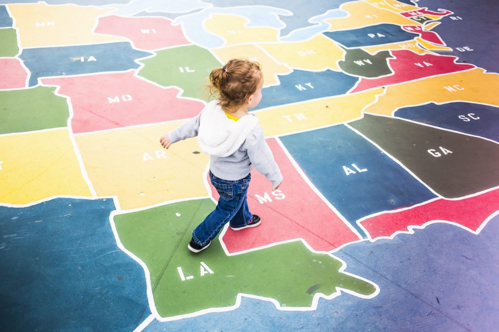 toddler walking over map of usa in playground 2022 03 04 01 45 03 utc